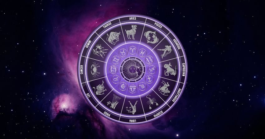 Zodiac wheel surrounded by stars and cosmic light representing astrology and the zodiac signs