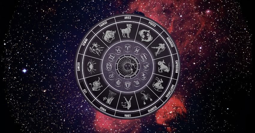 Zodiac wheel surrounded by stars and a colorful galaxy background