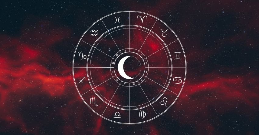 Zodiac wheel with a crescent moon surrounded by red and black clouds