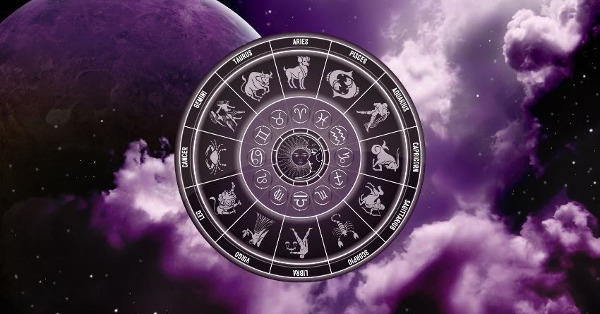Zodiac wheel under a dark purple sky representing emotional changes and heartbreak