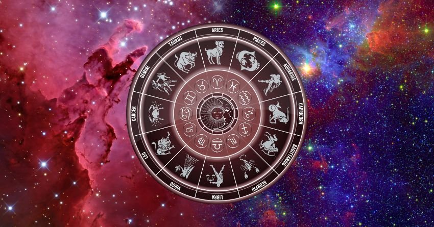 Astrology zodiac wheel surrounded by colorful stars and a cosmic galaxy background
