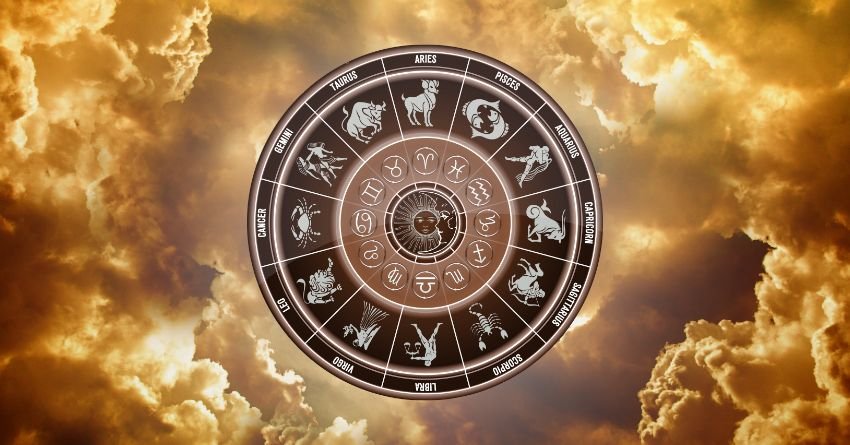 Zodiac wheel surrounded by golden cosmic clouds representing astrology and horoscope