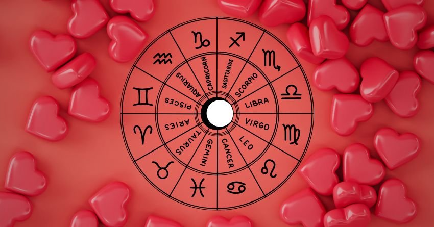 Red zodiac wheel surrounded by rose petals on a soft red background