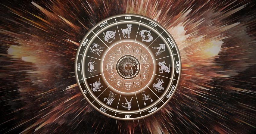 Glowing zodiac wheel surrounded by warm brown and orange cosmic energy