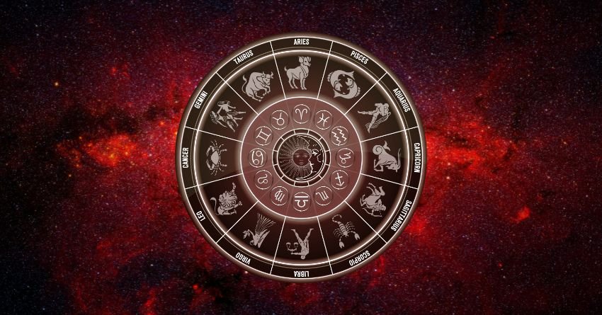 Zodiac wheel and astrological symbols on a dark red cosmic background